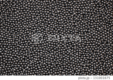 Shotgun pellets. Birdshot texture background. A pile of shotgun pellets texture background Shotgun pellets. Birdshot texture background. A pile of shotgun pellets texture background 131001675