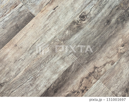 Laminated wood floor. Empty room with floating laminate in new apartment. Dark walnut chevron surface. Premium oiled oak parquet texture. Laminated wood floor. Empty room with floating laminate in new apartment. Dark walnut chevron surface. Premium oiled oak parquet texture. 131001697