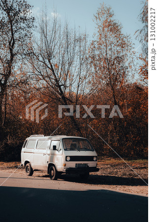 Vintage White Van Parked by Autumn Forest Road Vintage White Van Parked by Autumn Forest Road 131002217