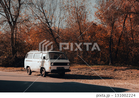 Vintage White Van Parked by Autumn Forest Road Vintage White Van Parked by Autumn Forest Road 131002224