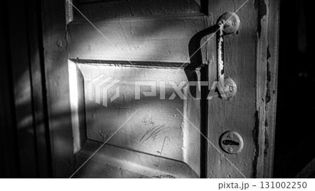 Black and White Old Wooden Door with Dramatic Shadows Black and White Old Wooden Door with Dramatic Shadows 131002250
