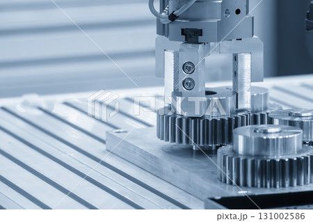 The high technology material handling process robotic system with metal gear parts in the blue tone. The high technology material handling process robotic system with metal gear parts in the blue tone. 131002586