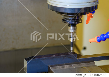 The CNC milling machine rough cutting the aluminum housing parts with flat nose end mill tool. 131002588