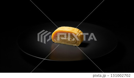 Rolled Egg Omelet Slice on Dark Background 131002702
