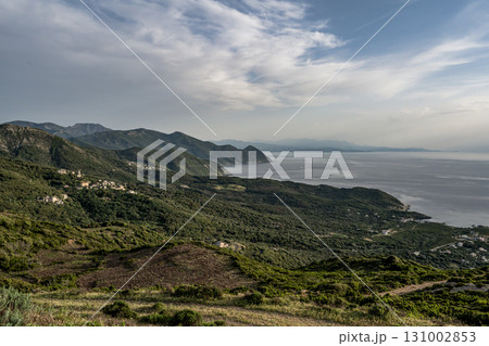 Village beach view Roadtrip Winding road along rocky coast of Cap Corse peninsula on Corsica island France 131002853