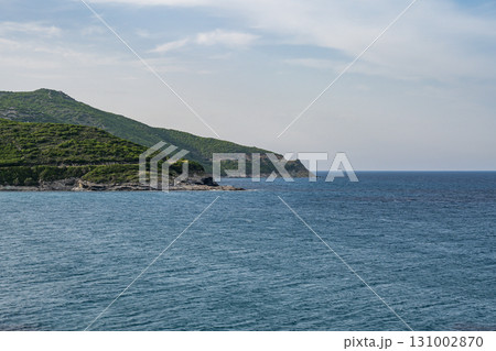 Village beach view Roadtrip Winding road along rocky coast of Cap Corse peninsula on Corsica island France Village beach view Roadtrip Winding road along rocky coast of Cap Corse peninsula on Corsica island France 131002870
