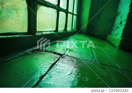 A dark room with a window and a green tile floor. Toned. 131003282
