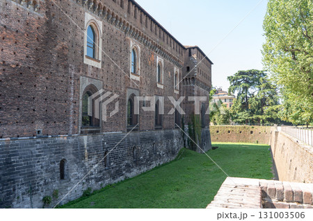 Defensive ditch Sforza Castle in Milan. Ancient Italian architecture. 131003506