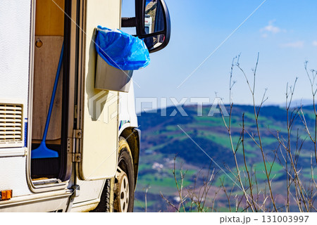 Camper door with trash can. 131003997