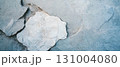 Blank space in the center of a rustic light stone wall with a rough texture invites creativity. 131004080