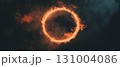 Vibrant orange flames create a symmetrical fire ring, glowing intensely on a dark backdrop. 131004086
