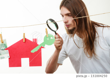 Man seller with money and house 131004250