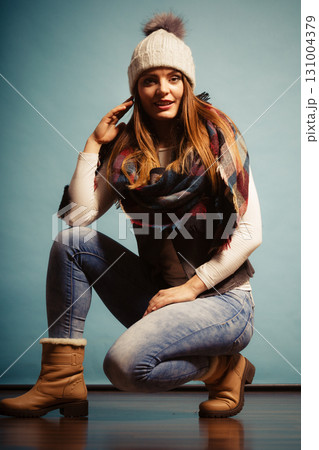 Fashionable girl in autumn warm clothing Fashionable girl in autumn warm clothing 131004379