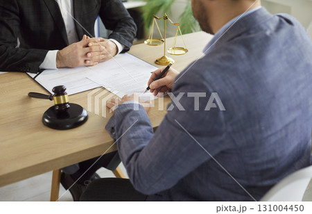 Lawyer working on office sighing a contract with a man client. Legal law and advice concept. 131004450