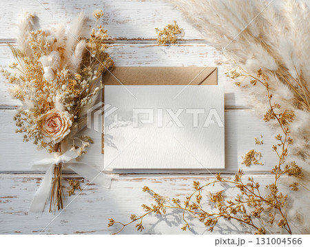 flat lay with a blank card and kraft envelope 131004566