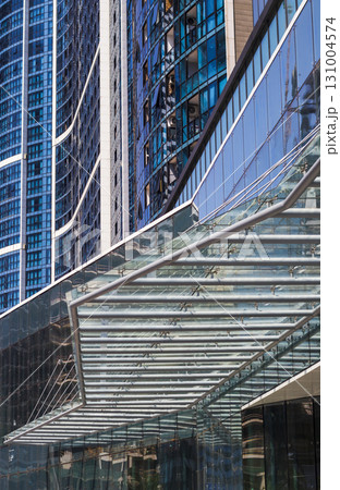 Conceptual shot of the textured wall of the modern facade of the building 131004574