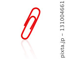 Red paperclip isolated on white background with reflection. Stock photo. 131004661