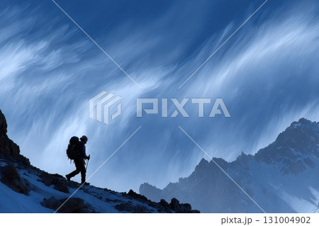 Solo Hiker Silhouetted Against Dramatic Time-Bending Sky in Majestic Landscape Solo Hiker Silhouetted Against Dramatic Time-Bending Sky in Majestic Landscape 131004902