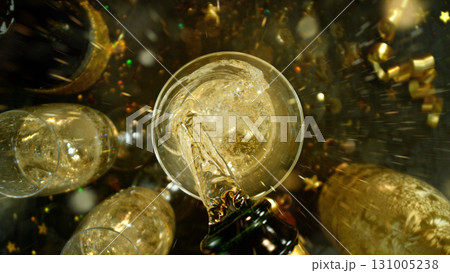 Freeze motion of pouring champagne into flute. Concept of celebration and success. Freeze motion of pouring champagne into flute. Concept of celebration and success. 131005238