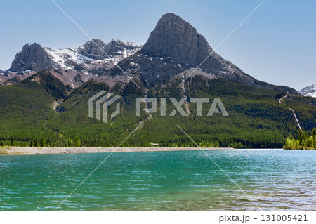 Scenic lake with clear green waters and the mountain with trees. Scenic lake with clear green waters and the mountain with trees. 131005421