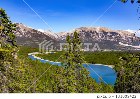 Scenic lake with clear blue waters among mountains and forests. Scenic lake with clear blue waters among mountains and forests. 131005422