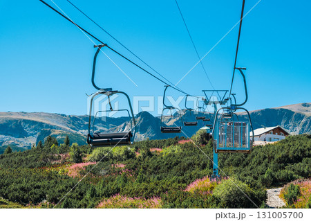 Chair Lift above the mountains and green forest of Bulgaria. Eco tourism. Tourist attraction. Seven Rila lakes. Cable car in the Rila Mountains 131005700