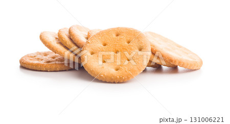 Crispy round salted crackers isolated on white background. Crispy round salted crackers isolated on white background. 131006221