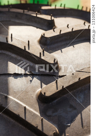 Detailed closeup of rubber tire surface 131006424