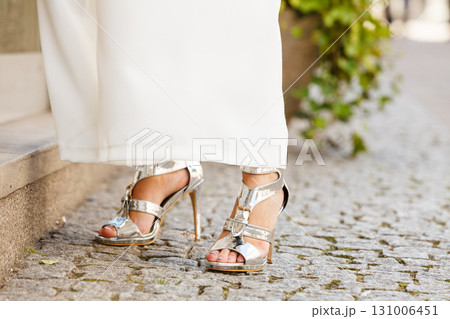 Woman wearing high heels and culottes Woman wearing high heels and culottes 131006451