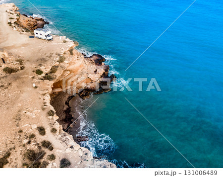 Camper on coast in Spain. Aerial view 131006489