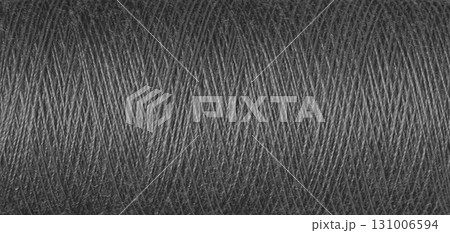 macro texture of a skein of grey sewing thread macro texture of a skein of grey sewing thread 131006594