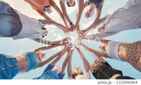 School friends coming together in a circle, representing their unity, teamwork, and strong bond School friends coming together in a circle, representing their unity, teamwork, and strong bond 131006864