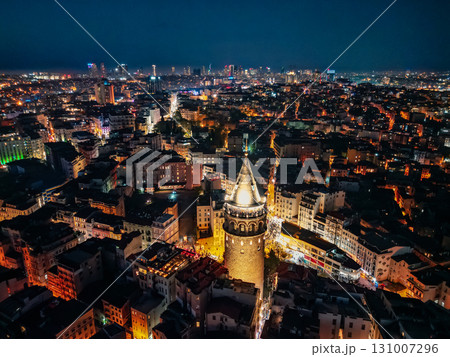 Aerial view of Galata Tower above Beyoglu crowds at night, Istanbul, Turkiye Aerial view of Galata Tower above Beyoglu crowds at night, Istanbul, Turkiye 131007296