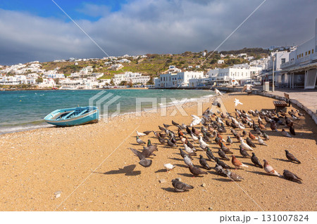 Beach with pigeons and boat in Mykonos, Mykonos, Greece 131007824
