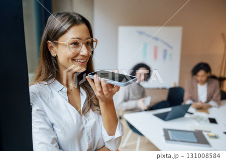 A Businesswoman Actively Engaging in a Meaningful Conversation During a Business Meeting 131008584