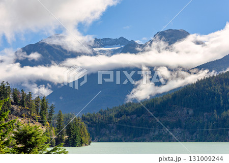 Mountain landscape with cloudy blue sky background 131009244