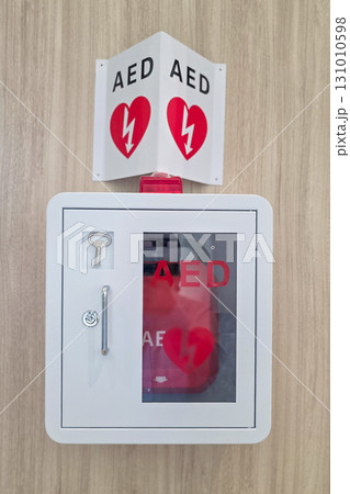 AED or Automated External Defibrillator installed on wall in public area as first aid in heart attack situation. AED or Automated External Defibrillator installed on wall in public area as first aid in heart attack situation. 131010598