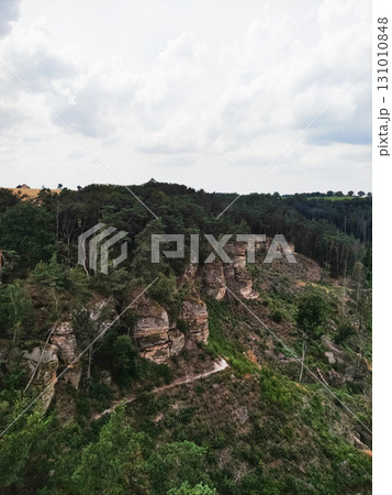 Hiking trail winding through kokorin valley in czech republic Hiking trail winding through kokorin valley in czech republic 131010848