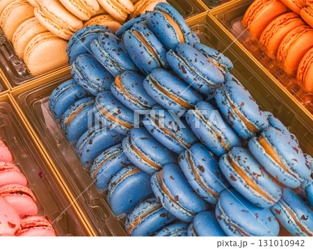 Delicious blue macarons filling pastry shop display in france 131010942