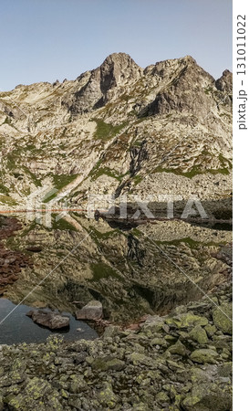 Rysy mountain reflecting in a glacial lake in the high tatras, slovakia Rysy mountain reflecting in a glacial lake in the high tatras, slovakia 131011022
