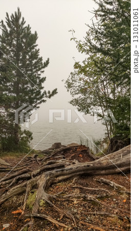Fog rolling over strbske pleso lake in the high tatras mountains of slovakia Fog rolling over strbske pleso lake in the high tatras mountains of slovakia 131011061