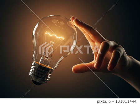 Hand Holding Glowing Light Bulb, Idea Concept 131011444