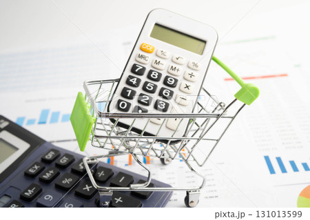 Online shopping, Shopping cart box on calculator, import export, finance commerce. Online shopping, Shopping cart box on calculator, import export, finance commerce. 131013599