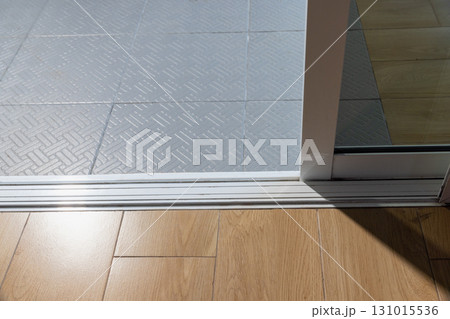 Dust on sliding door sills and bottom tracks ,  these areas need cleaning. 131015536