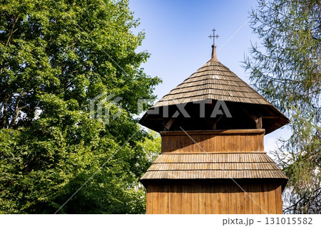 A Charming Wooden Structure Beautifully Surrounded by Lush Greenery and Natures Beauty A Charming Wooden Structure Beautifully Surrounded by Lush Greenery and Natures Beauty 131015582
