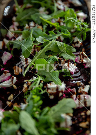 A delicious Fresh Beet Salad that features vibrant Arugula and a variety of Nuts A delicious Fresh Beet Salad that features vibrant Arugula and a variety of Nuts 131015758