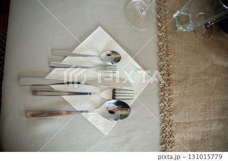 A Beautifully Elegant Flatware Arrangement Placed on a Napkin for a Stylish Setting 131015779