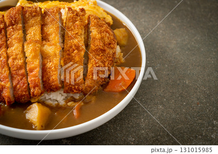 curry rice with fried pork cutlet and creamy omelet curry rice with fried pork cutlet and creamy omelet 131015985