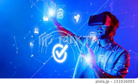 Young man using virtual reality headset to interact with digital icons and graphics, exploring technology trends, innovation, and futuristic experiences. Raster Young man using virtual reality headset to interact with digital icons and graphics, exploring technology trends, innovation, and futuristic experiences. Raster 131016093