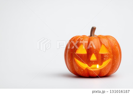 A cheerful Halloween Pumpkin featuring a glowing face that radiates festive joy and spirit 131016187